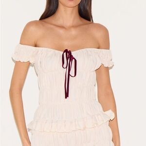PrettyLittleThing Cream Off-Shoulder Ruffle Jumpsuit with Burgundy Tie Detail